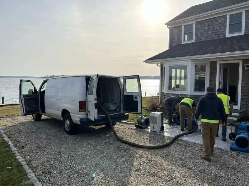 Restoration van staged with extraction hose run to the property in Belvedere Tiburon, California