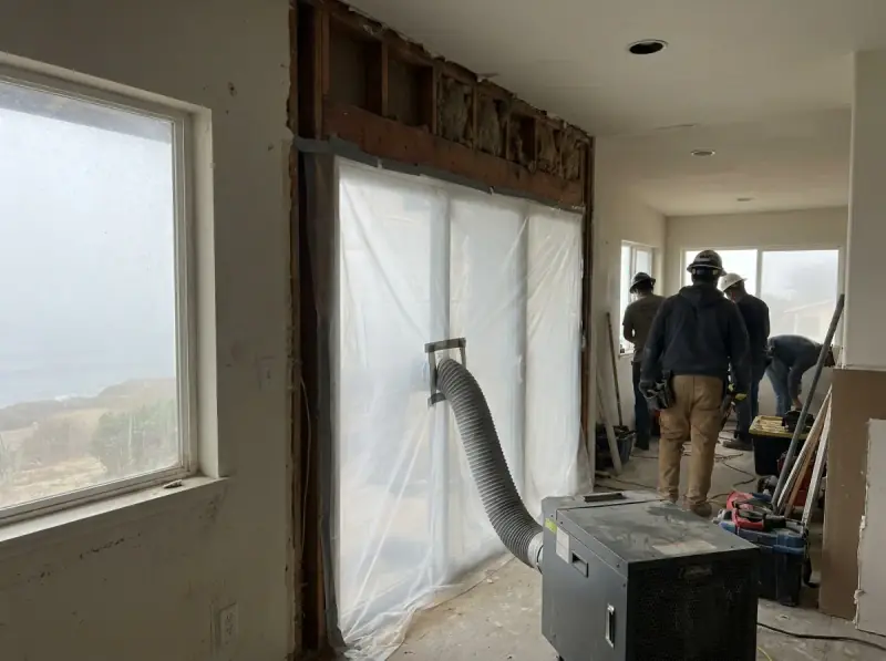 Plastic containment with a negative air machine and flood-cut drywall in Oxnard, California