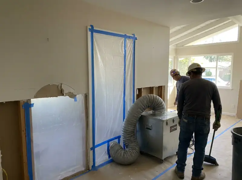 Plastic containment with a negative air machine and flood-cut drywall in Sunnyvale, California